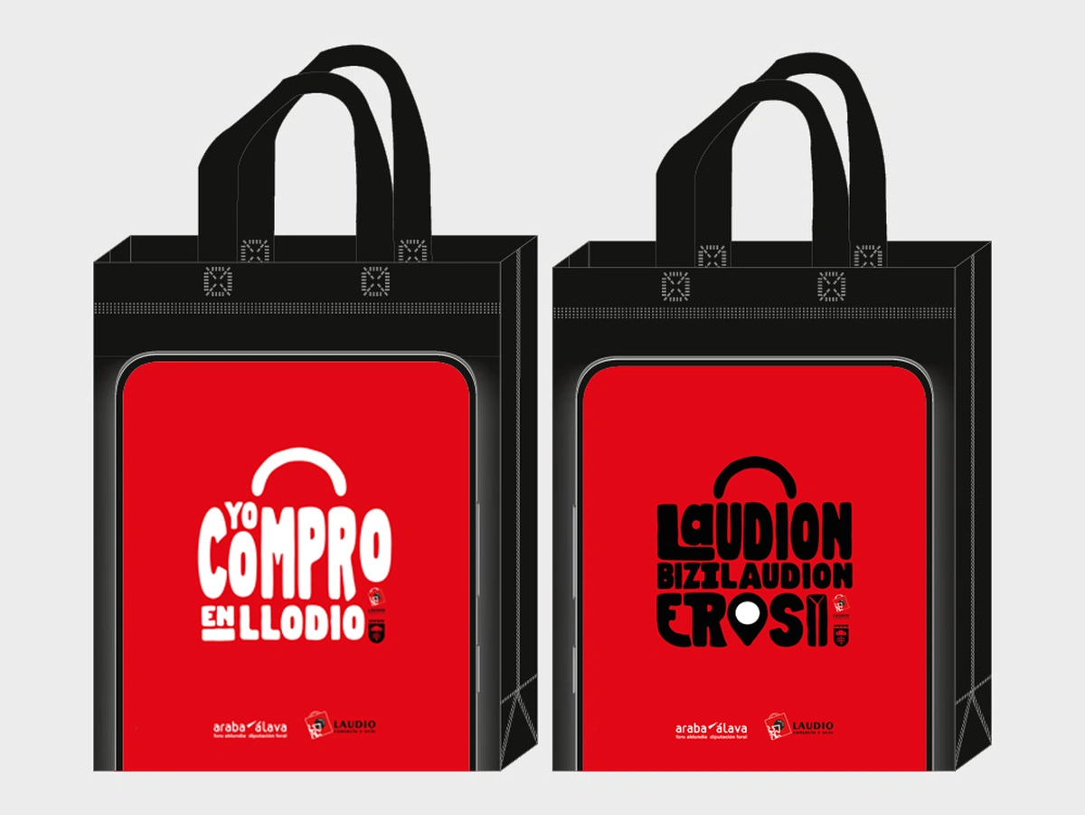 Bolsas reutilizables de la Merkataritza Festa de Llodio Diseño de las bolsas reutilizables de la campaña de comercio local de Llodio, con los lemas Yo compro en Llodio y Laudion bizi, Laudion erosi